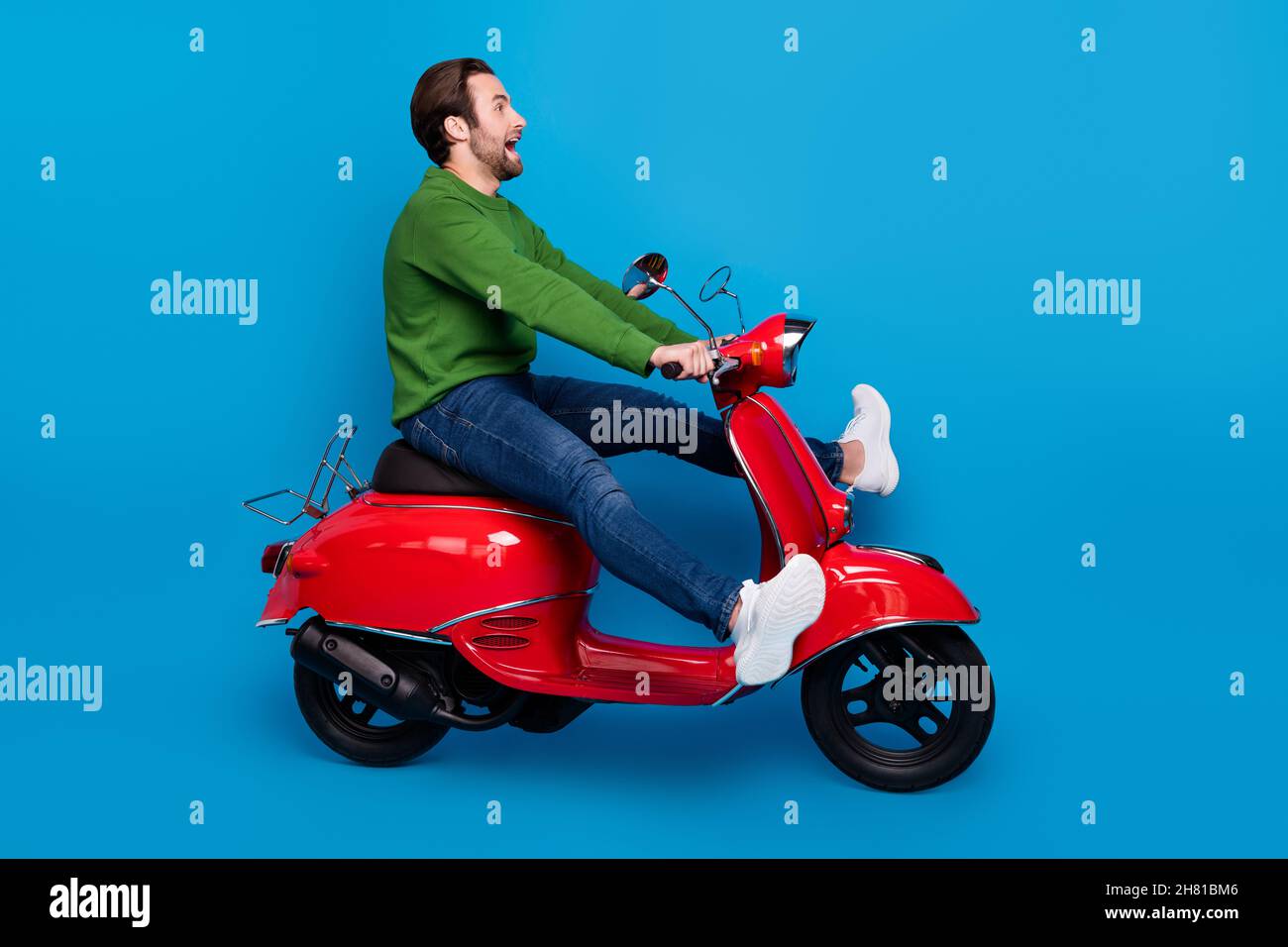 Young man ride retro scooter hi res stock photography and images