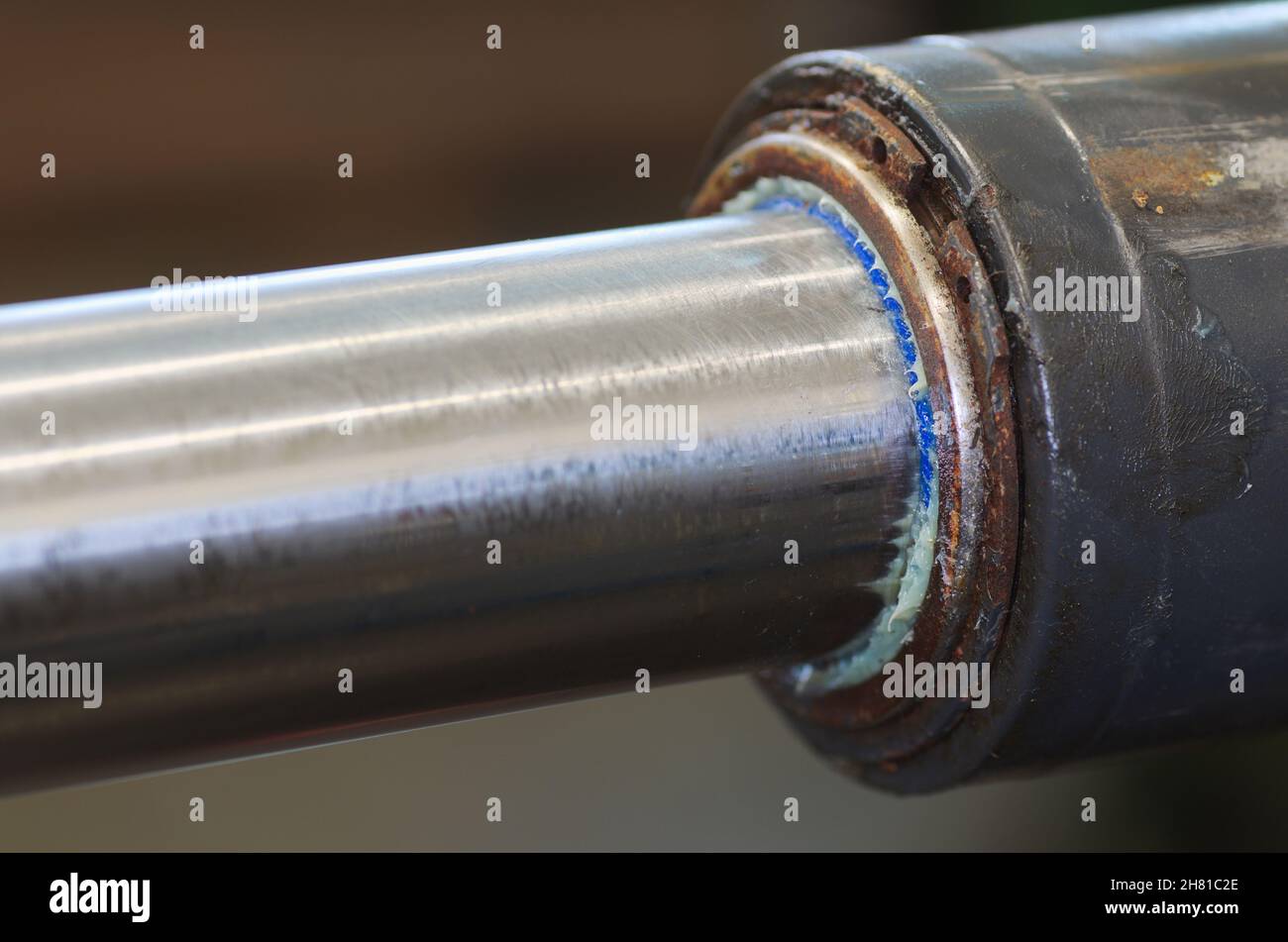 Piston rod focused on scraper ring Stock Photo Alamy