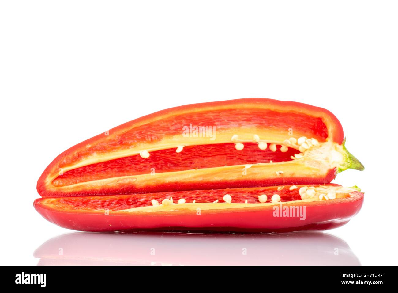 Two halves of red sweet pepper, close-up, isolated on white. Stock Photo