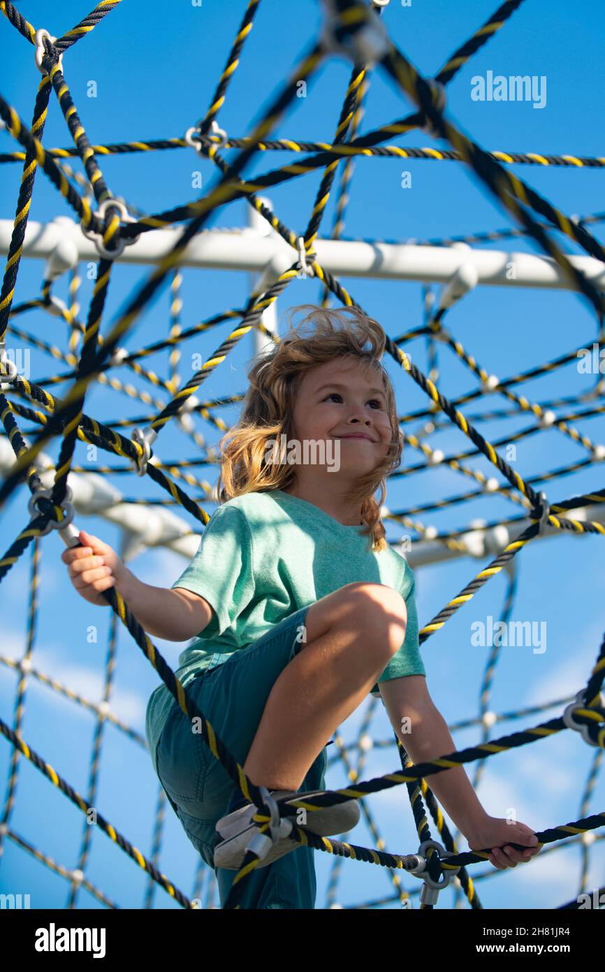 Adorable kid boy smiling happy playing at the playground Stock Photo ...
