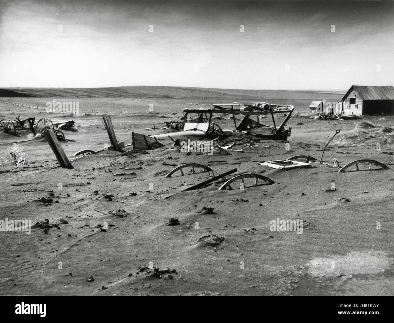 Buried machinery in South Dakota, during the Dust Bowl, an agricultural, ecological, and economic disaster in the Great Plains region of the USA. Stock Photo