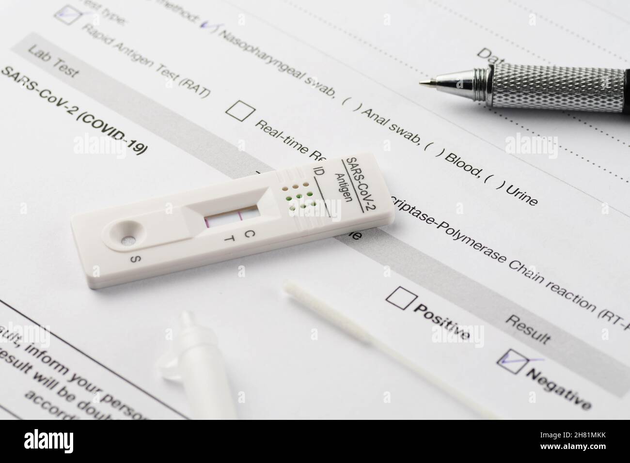 Close-up of negative result by rapid antigen test for SARS-CoV-2, COVID-19, on a test document paper. COVID-19, testing, medicine, pandemic and safety Stock Photo