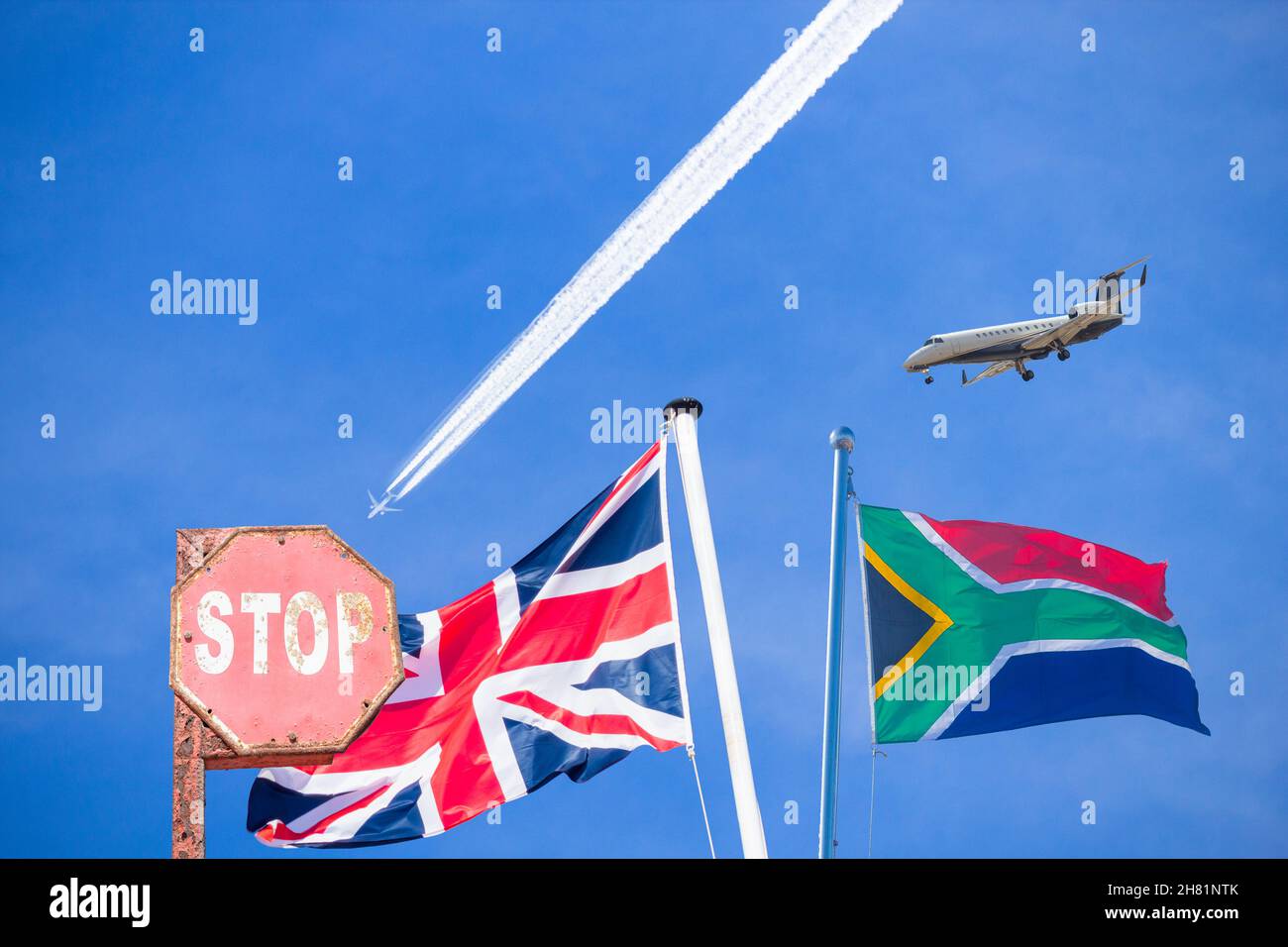 Flag of South Africa and UK with aircraft approaching UK flag. Concept image: flight ban from South Africa due to new B.1.1. 529 Covid variant Stock Photo