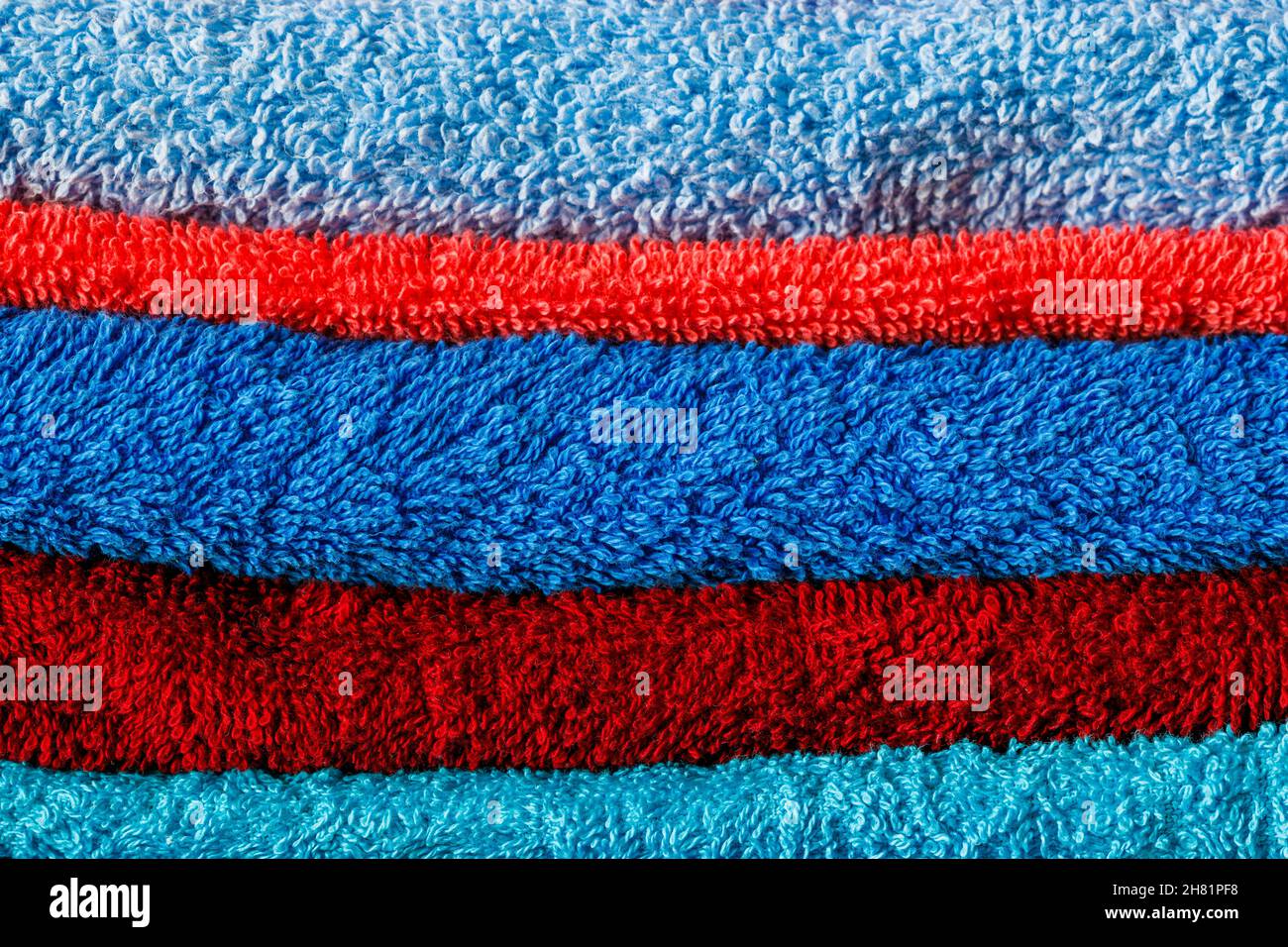 stack of colored towels full frame close-up background Stock Photo