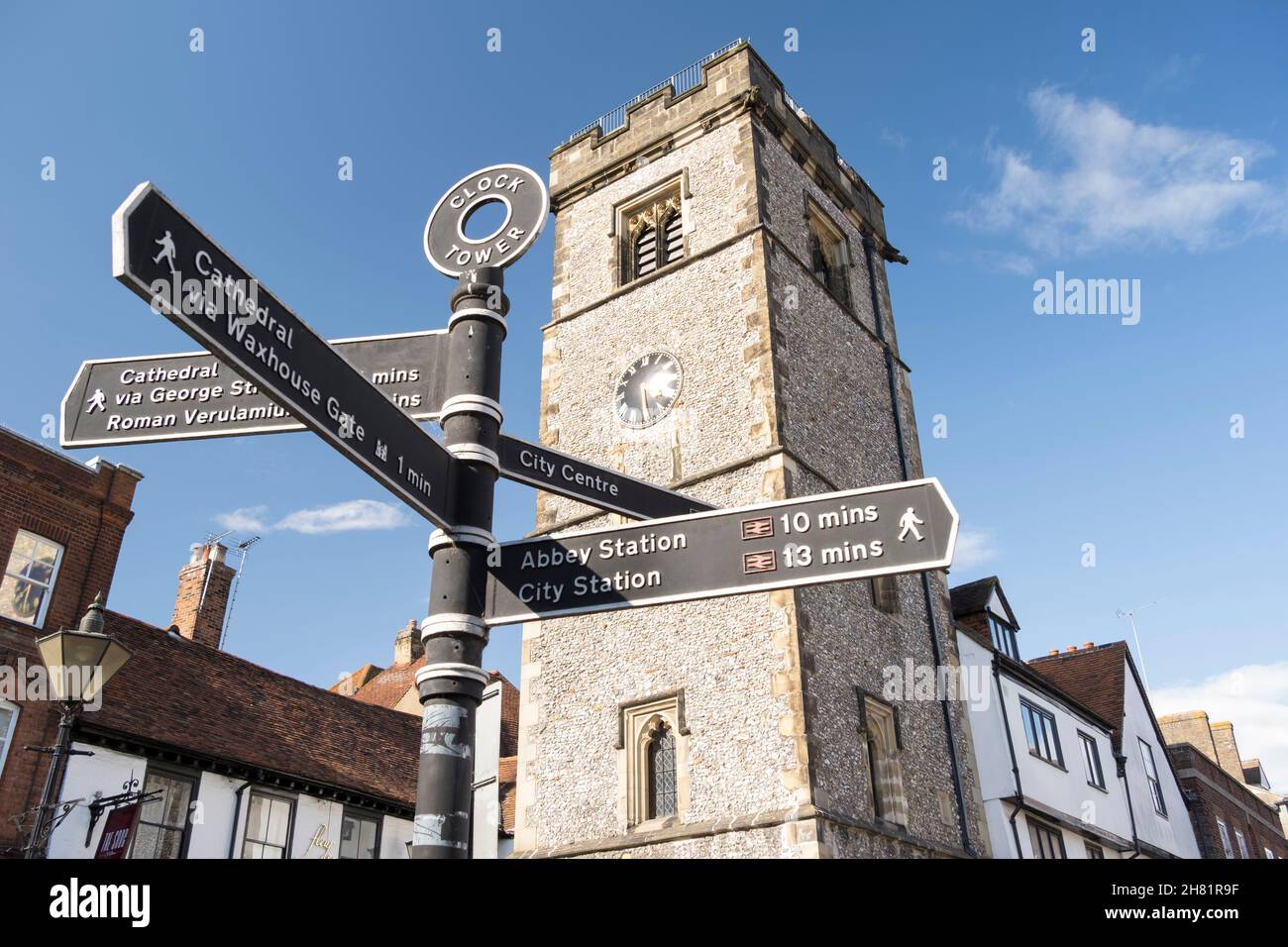 St Albans clock tower and tourist signpost, St Albans, Hertfordshire, UK. Stock Photo