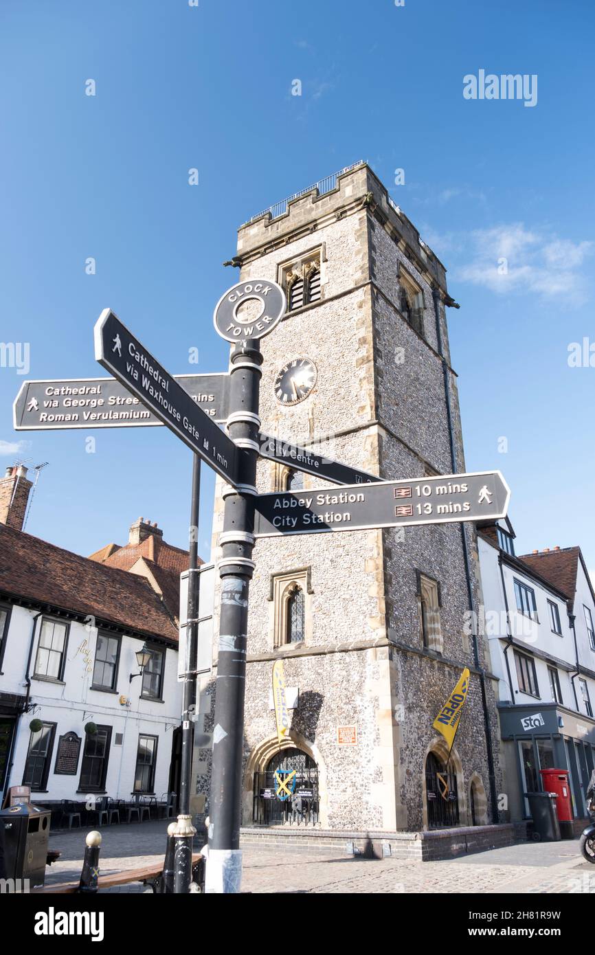 St Albans clock tower and tourist signpost, St Albans, Hertfordshire, UK. Stock Photo