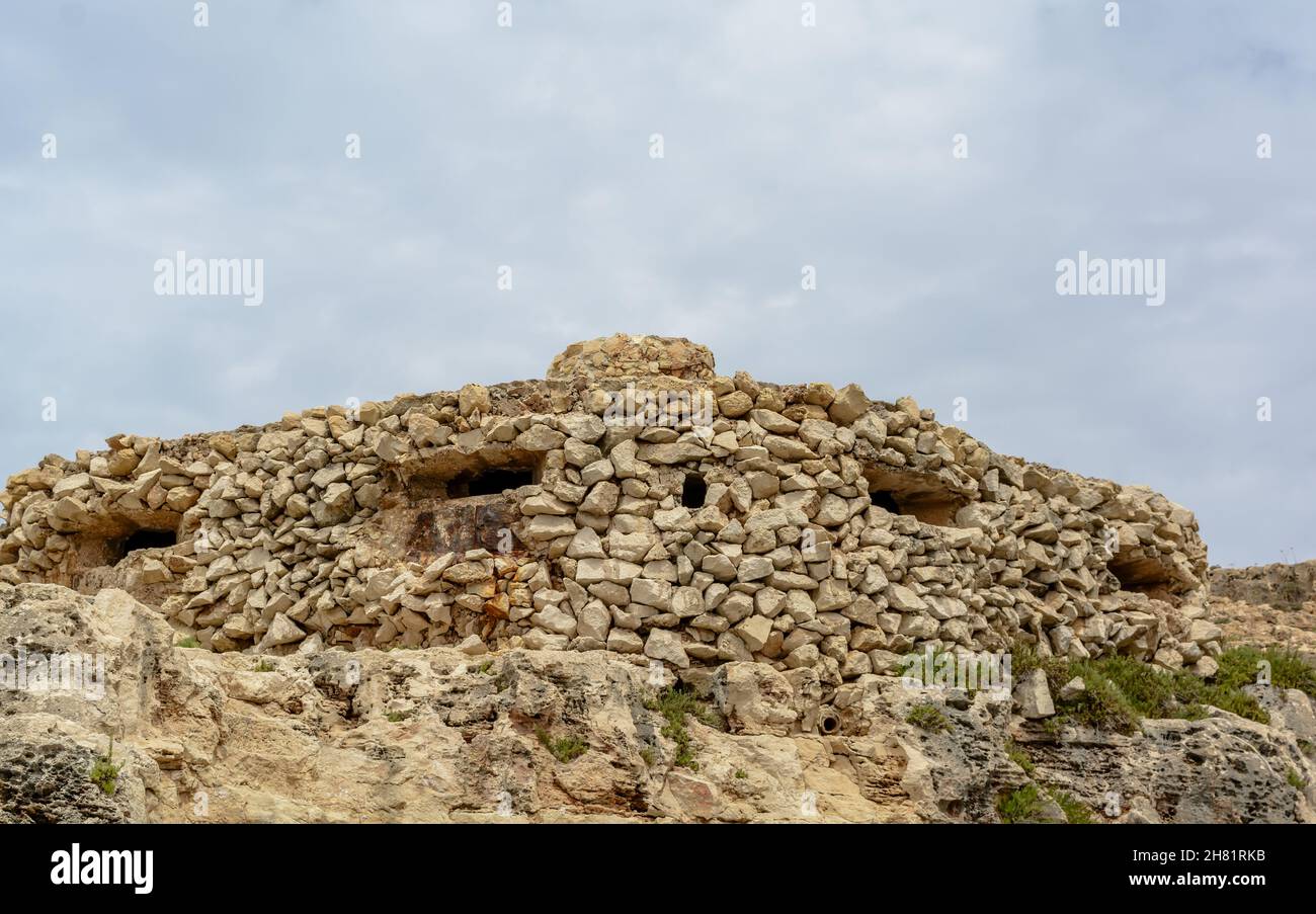 Camouflaged WW2 stone military pillbox at Qrendi, Malta Stock Photo