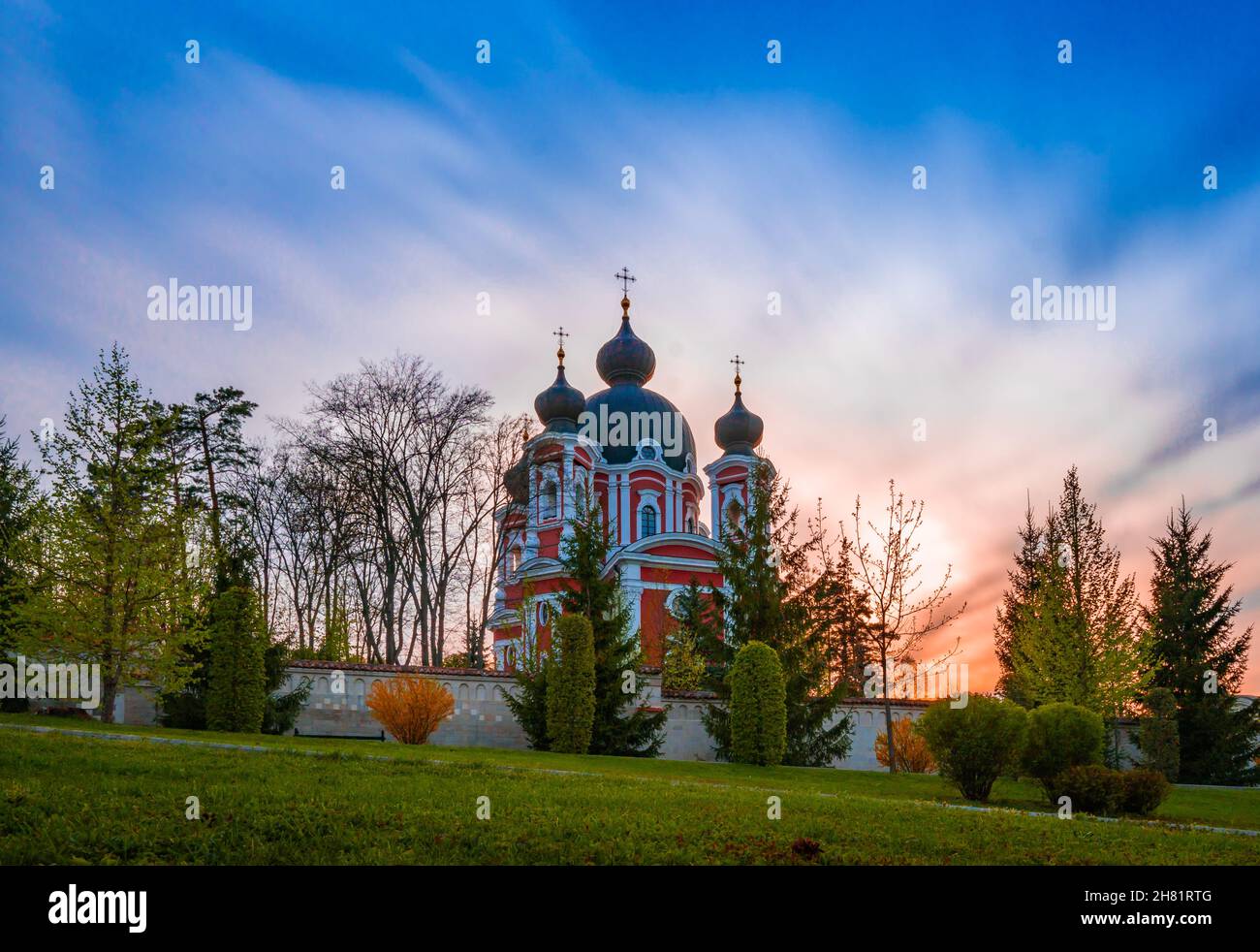Curchi Monastery surrounded by a garden during the sunrise in Curchi ...