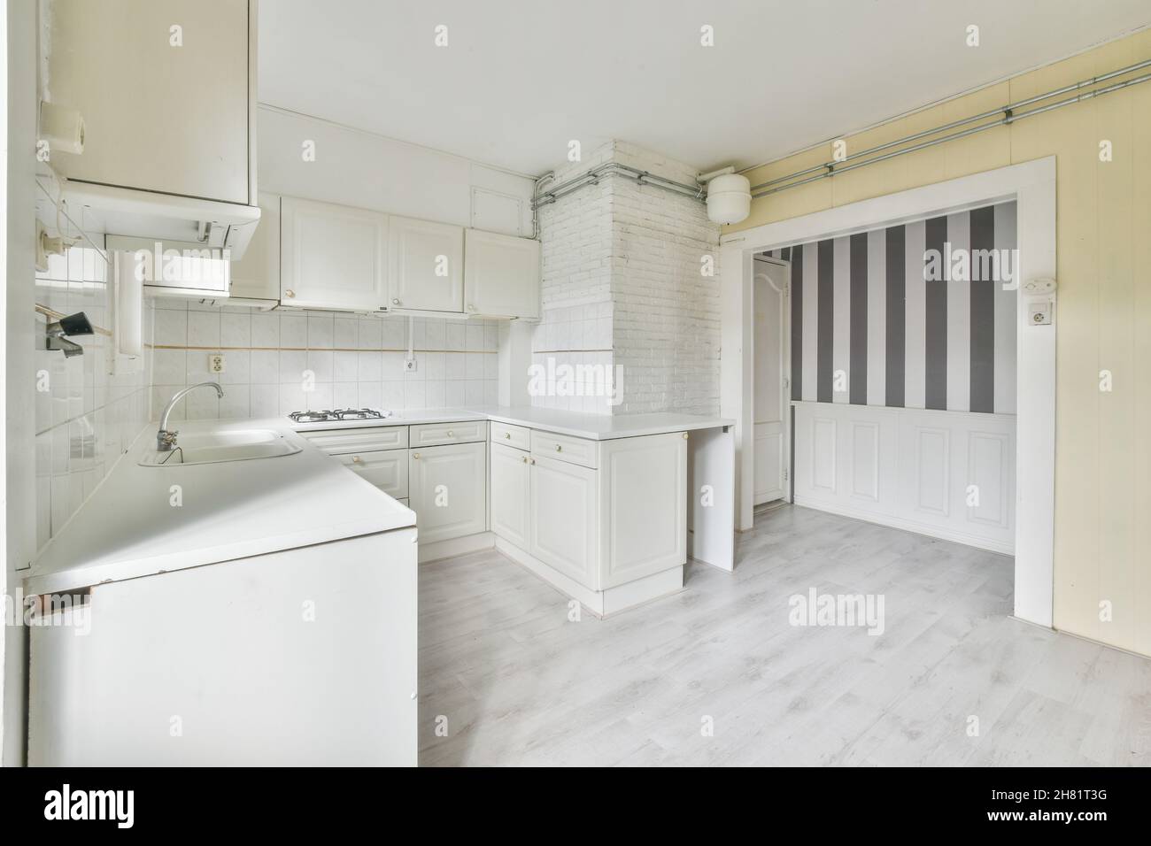 Interior of spacious light kitchen with modern white furniture Stock ...