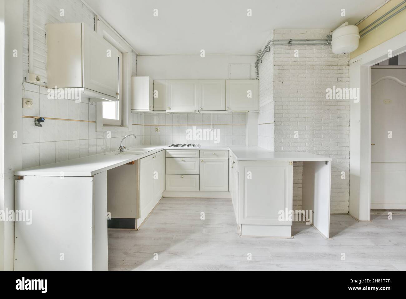 Interior of spacious light kitchen with modern white furniture Stock ...