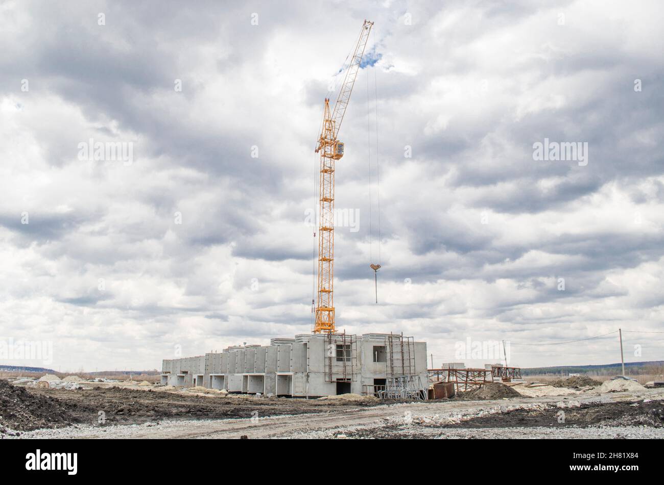 Lift crane building a new residential building Stock Photo