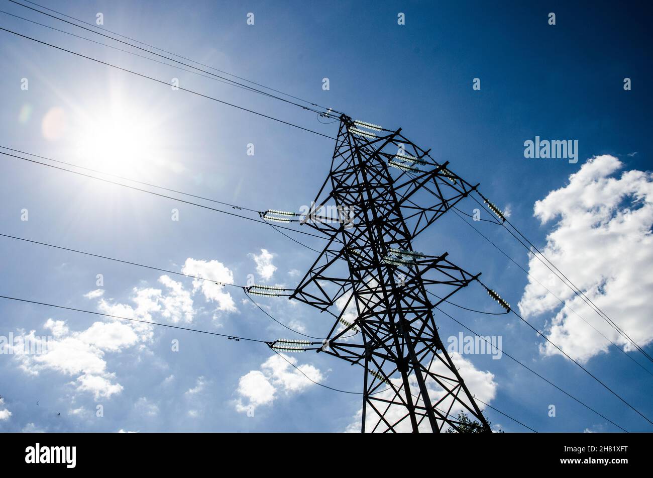 High voltage tower with sky background Stock Photo - Alamy