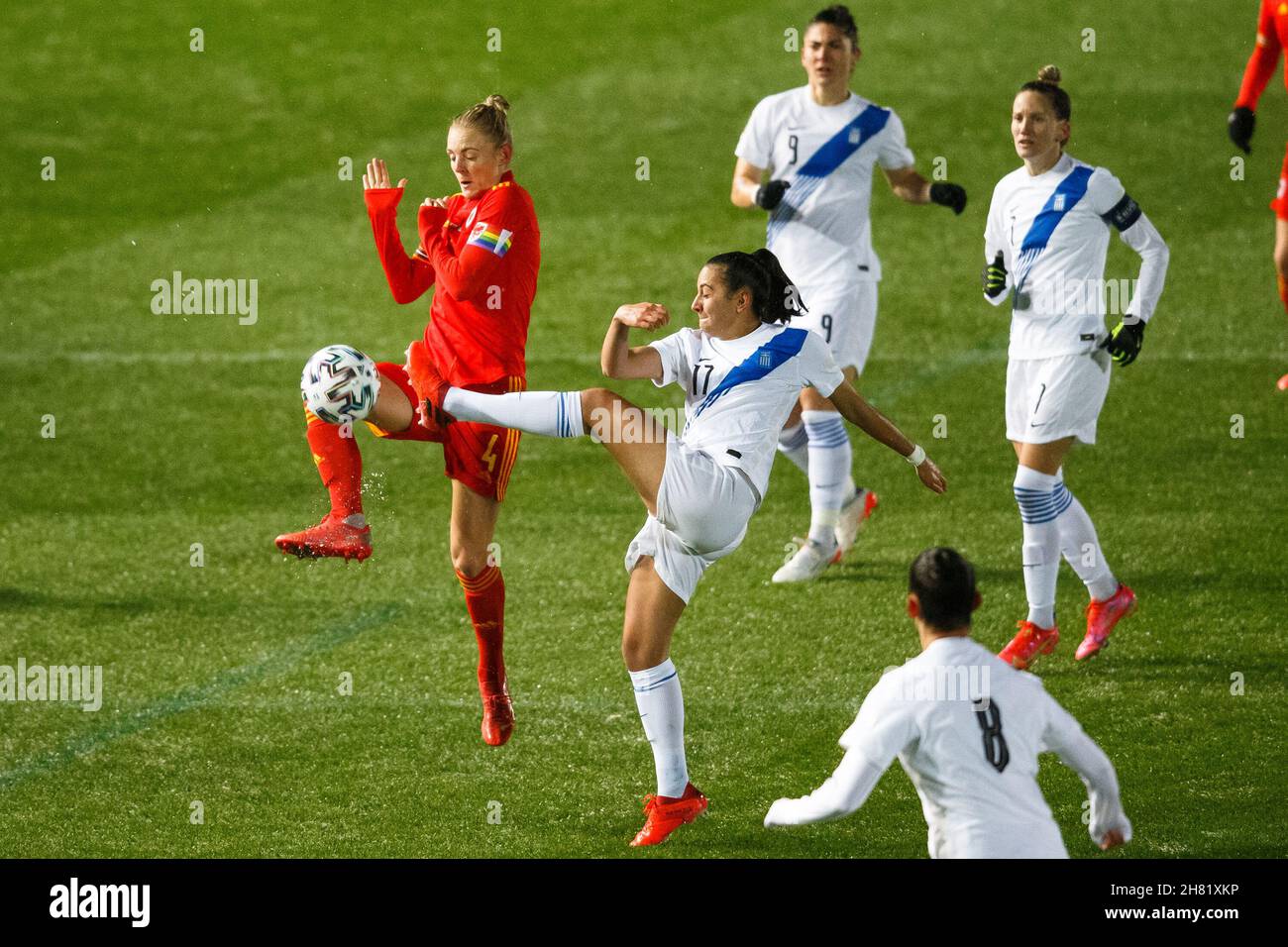 Llanelli, UK. 26 November, 2021. Athanasia Moraitou of Greece challenges Sophie Ingle of Wales during the Wales v Greece Women's World Cup Qualification match. Credit: Gruffydd Thomas/Alamy Stock Photo