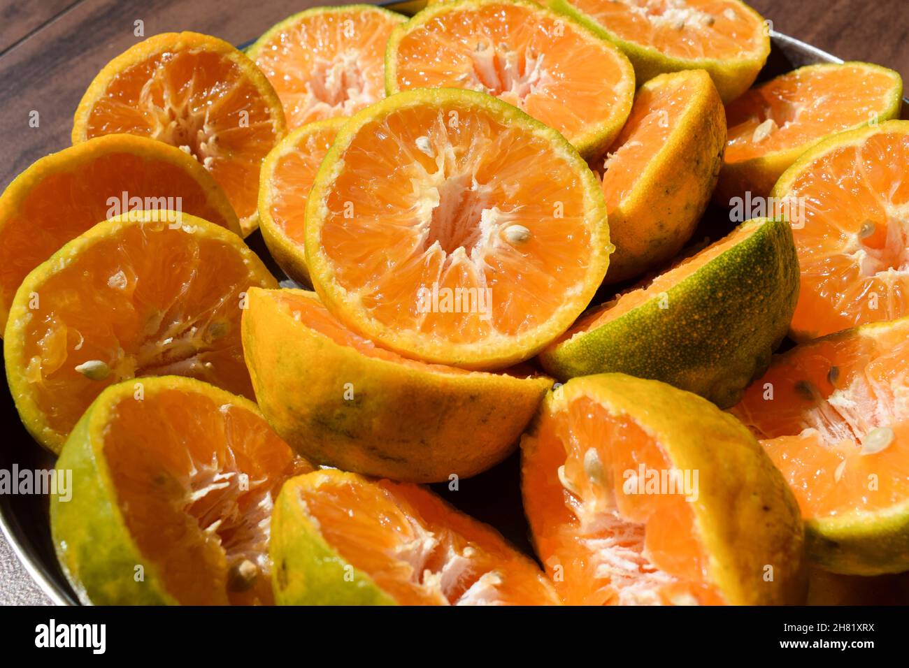 Orange, Malta fruits sliced in to half to take out juice Stock Photo