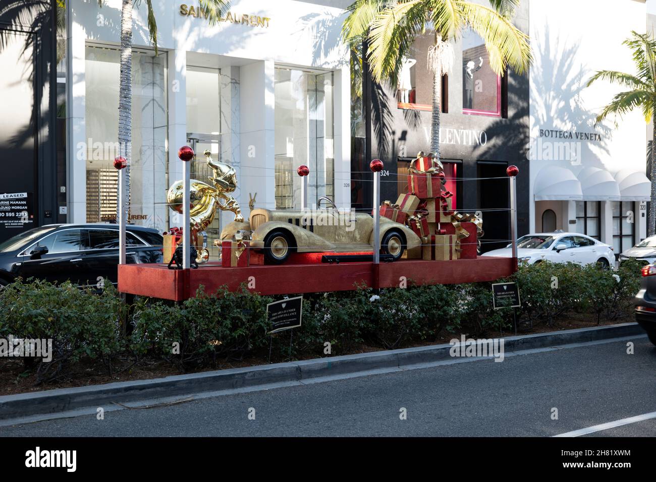 Beverly Hills, CA USA - November 25, 2021: Santas Elves and elaborate Christmas decorations on Rodeo Drive in front of the Saint Laurent and Valentino Stock Photo