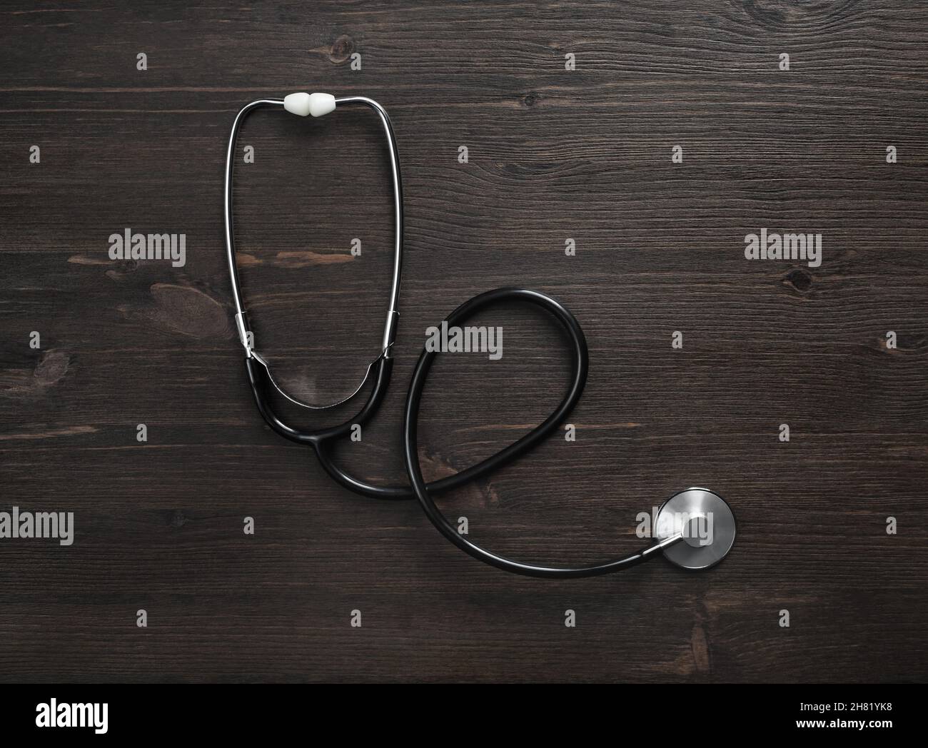 Medical stethoscope on wood table background. Flat lay Stock Photo - Alamy