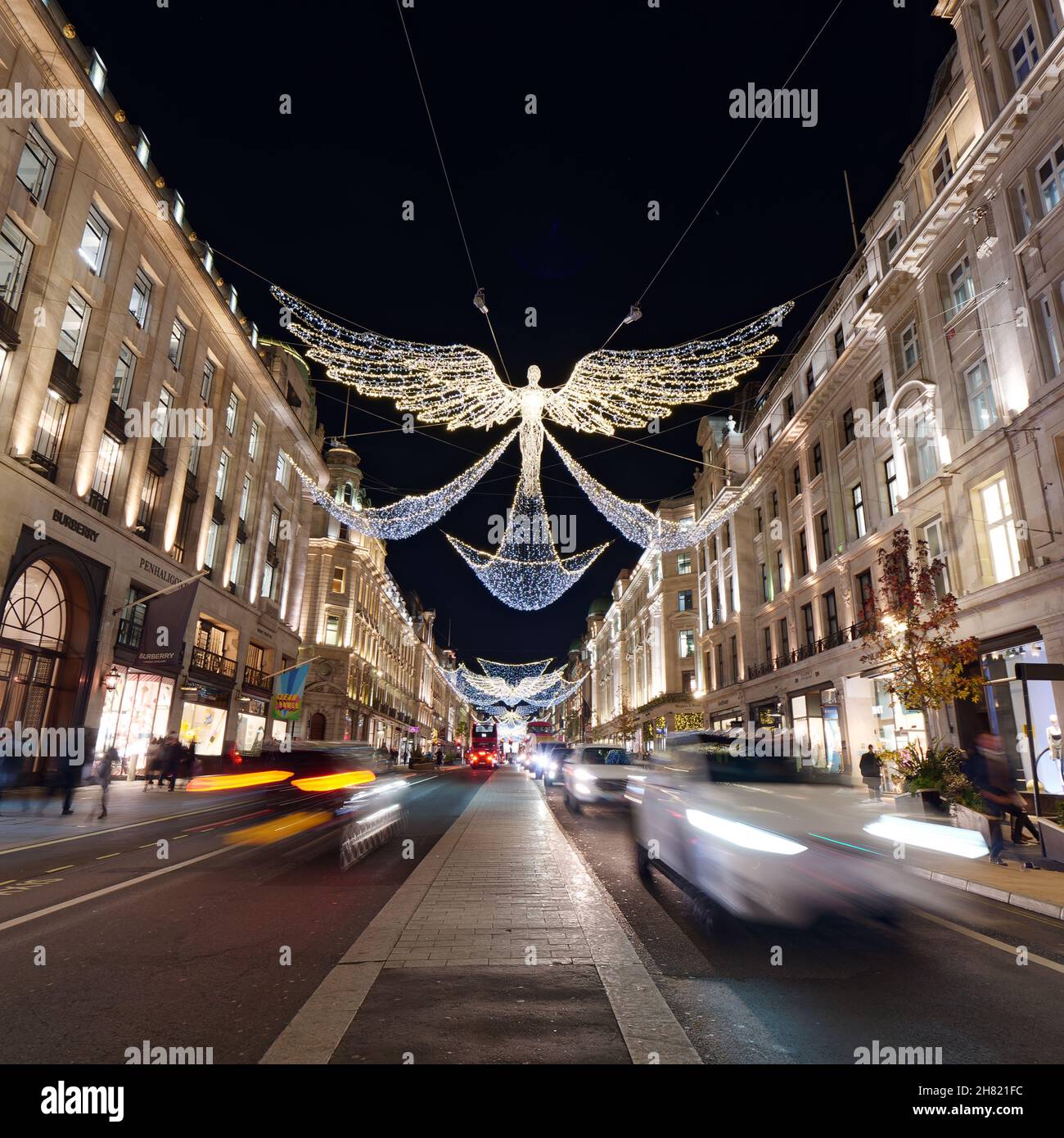 London, Greater London, England, November 23 2021: Spirits or Angels of Christmas in a festive Regent Street at night, Long Exposure. Stock Photo
