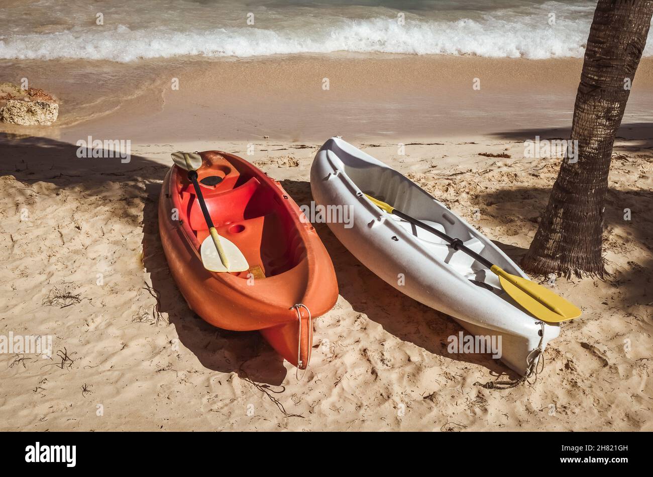 Two colorful kayaks on sand beach Stock Photo - Alamy