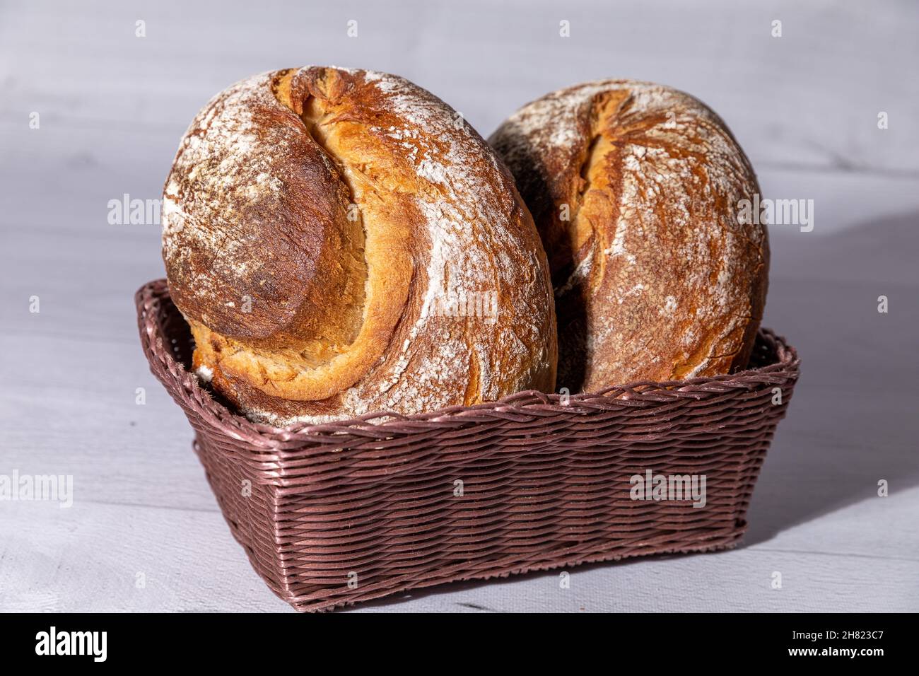 Loaf bread in supermarket basket hires stock photography and images