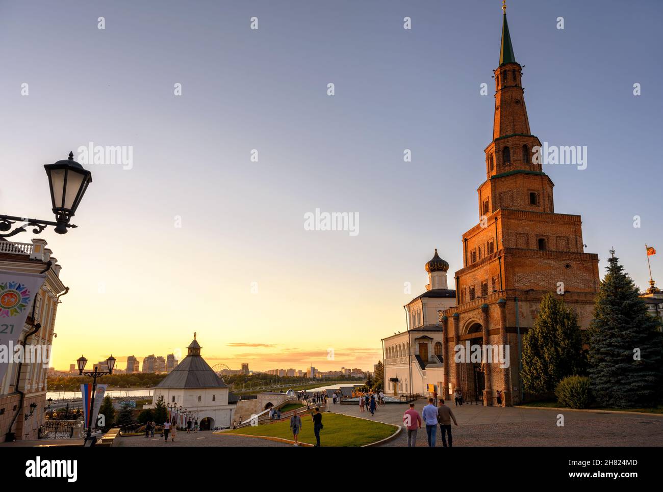 Kazan, Russia - June 17, 2021: People visit Kazan Kremlin at sunset, Tatarstan. This place is main famous tourist attraction of Kazan. Evening view of Stock Photo