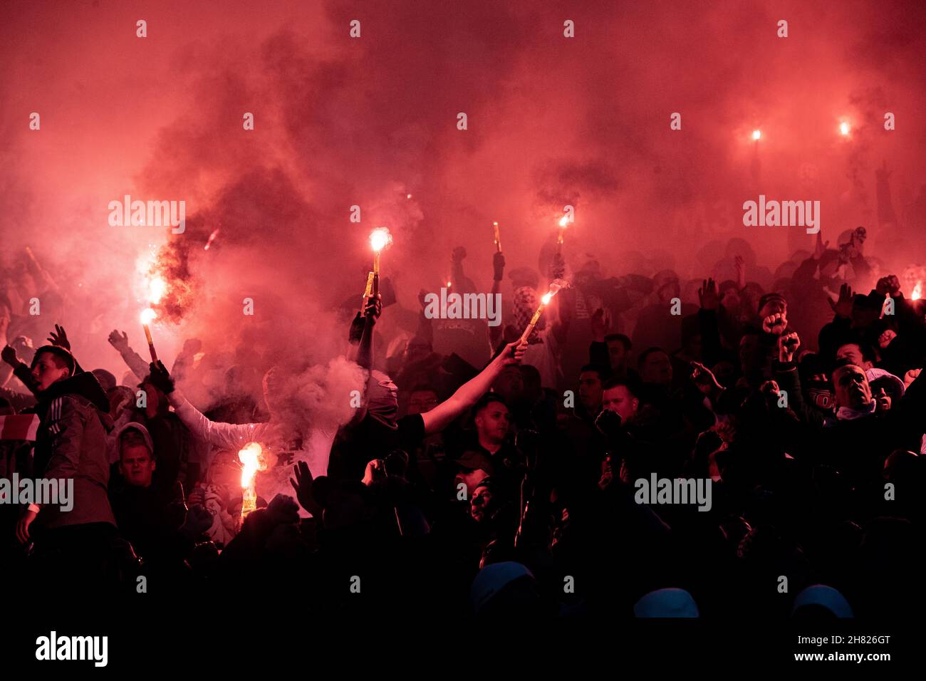 LEICESTER, ENGLAND - NOVEMBER 25: Legia Warszawa ultras fans set up flares during the UEFA Europa League group C match between Leicester City and Legi Stock Photo