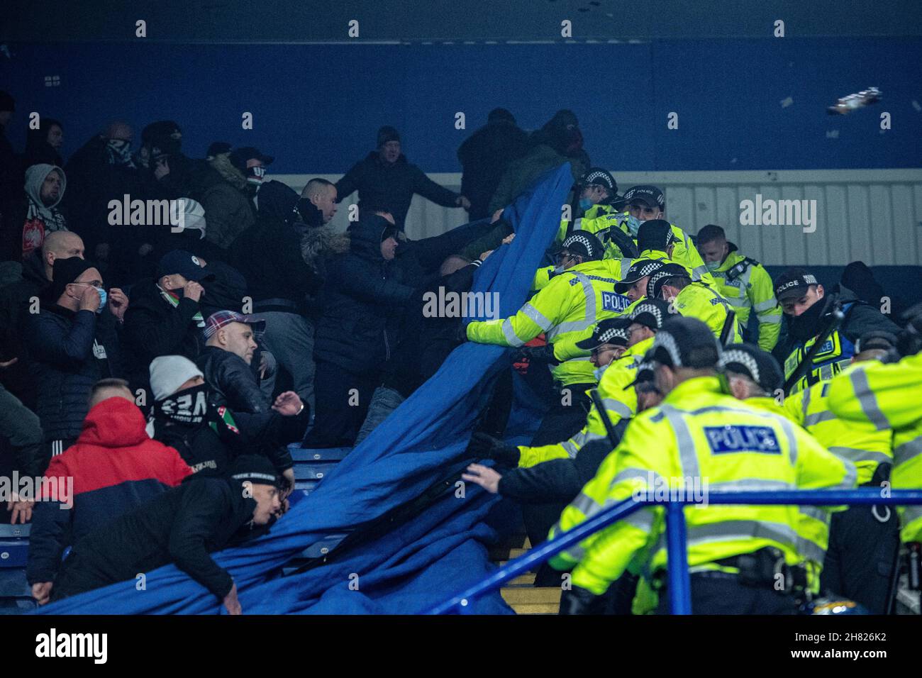 LEICESTER, ENGLAND - NOVEMBER 25: Legia Warszawa fans clash with police during the UEFA Europa League group C match between Leicester City and Legia W Stock Photo