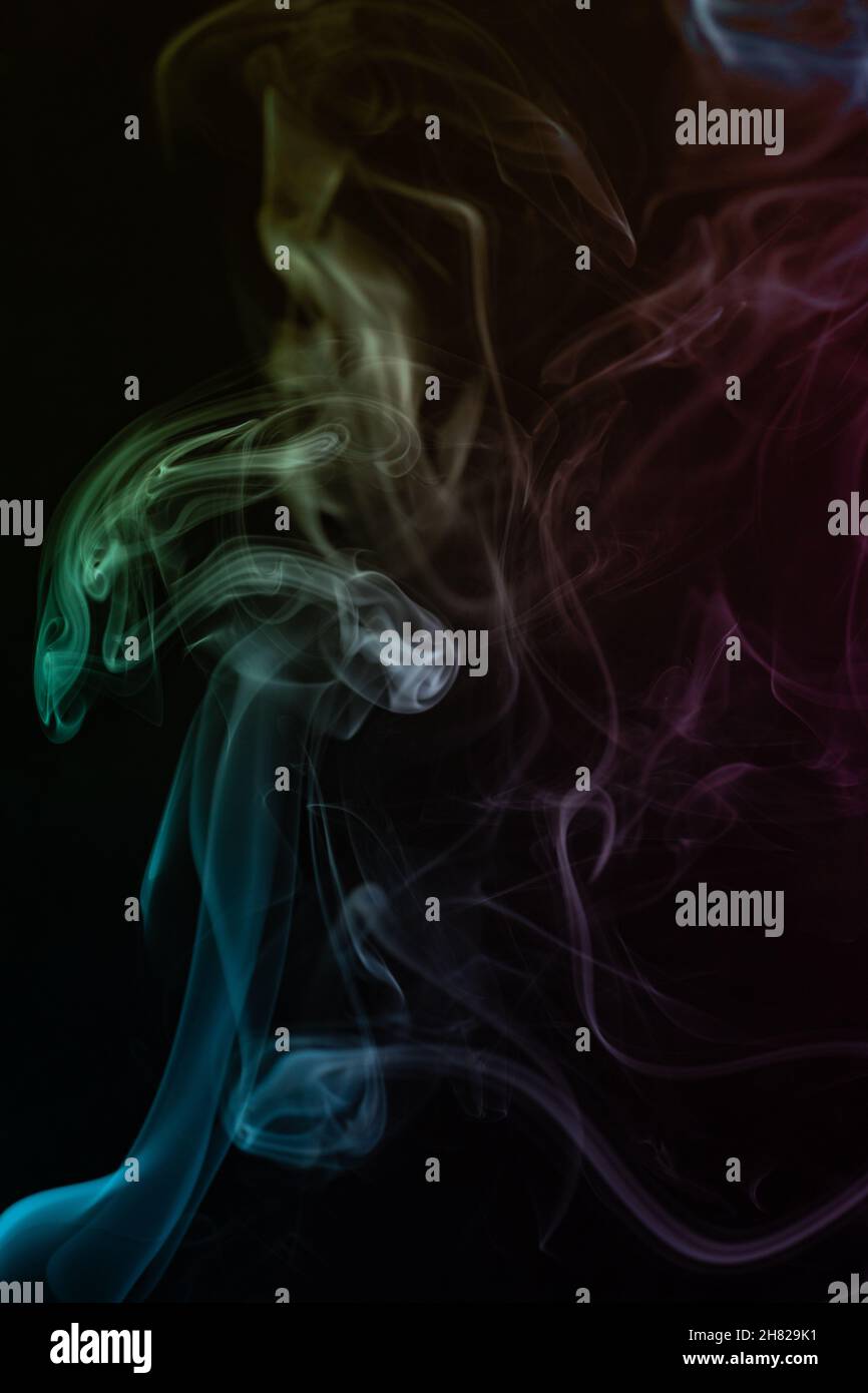 abstract colored smoke on black background Stock Photo - Alamy