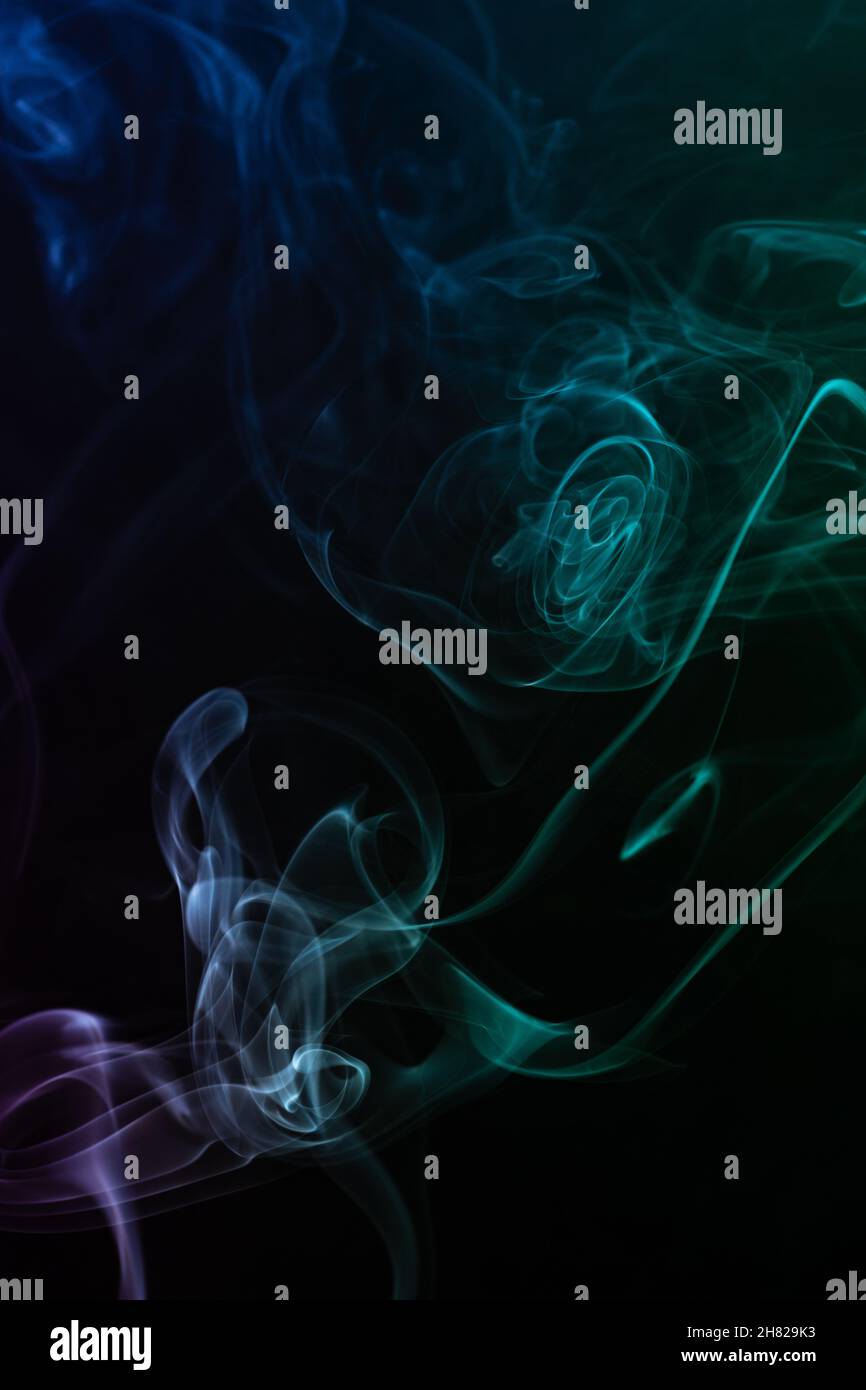 abstract colored smoke on black background Stock Photo - Alamy