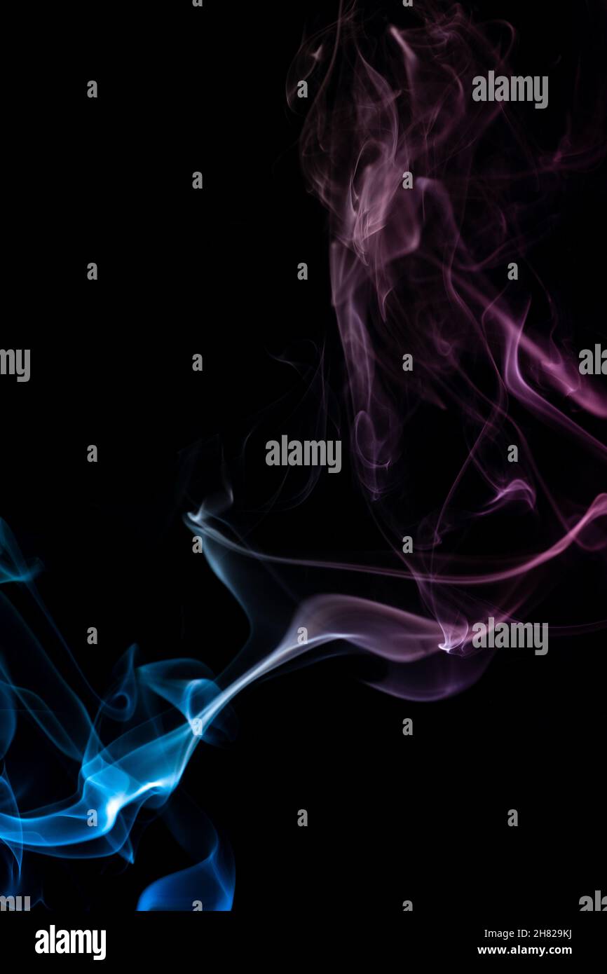 abstract colored smoke on black background Stock Photo - Alamy