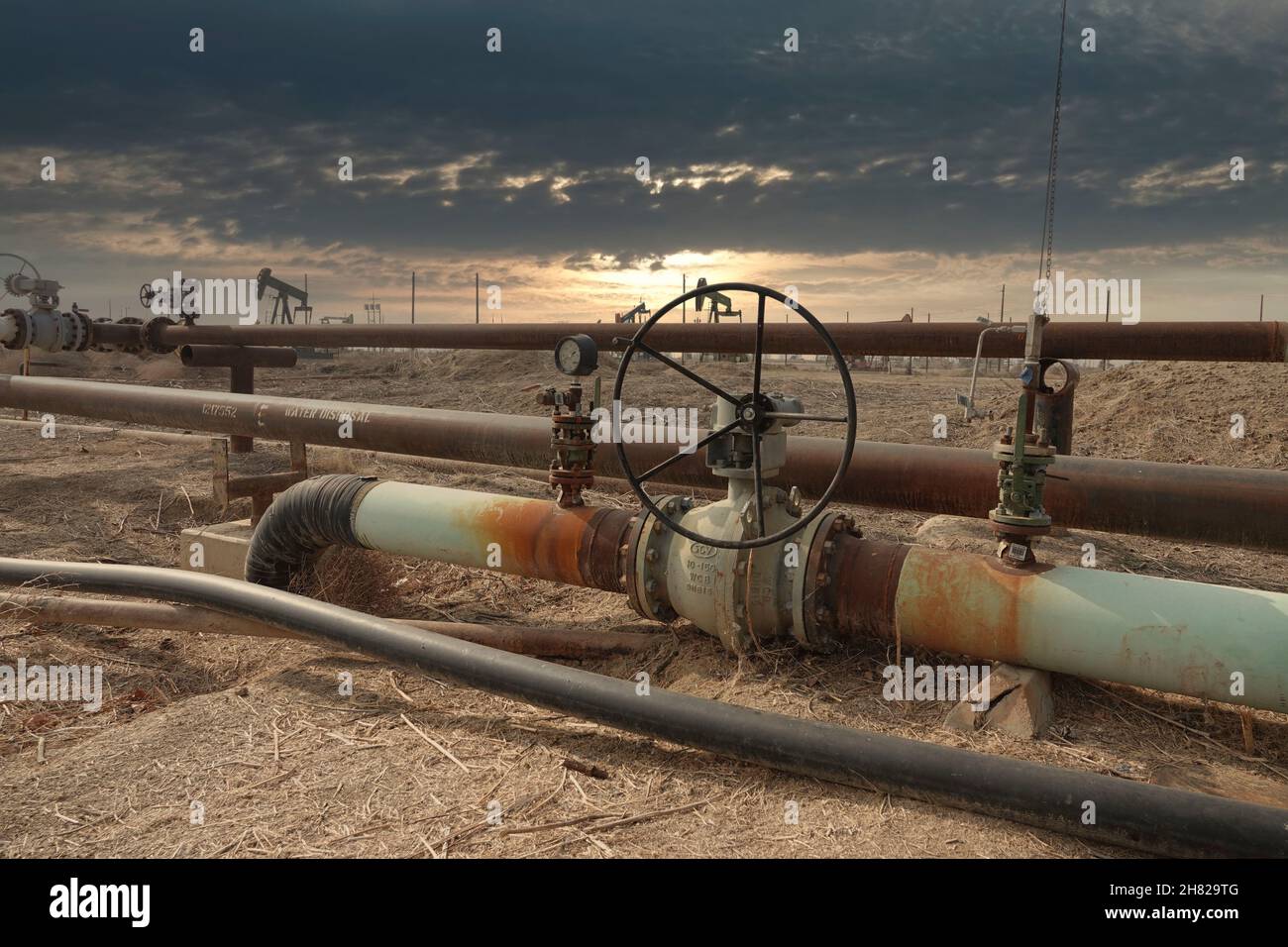 Moody light hovers over the Lost Hills oil field north west of