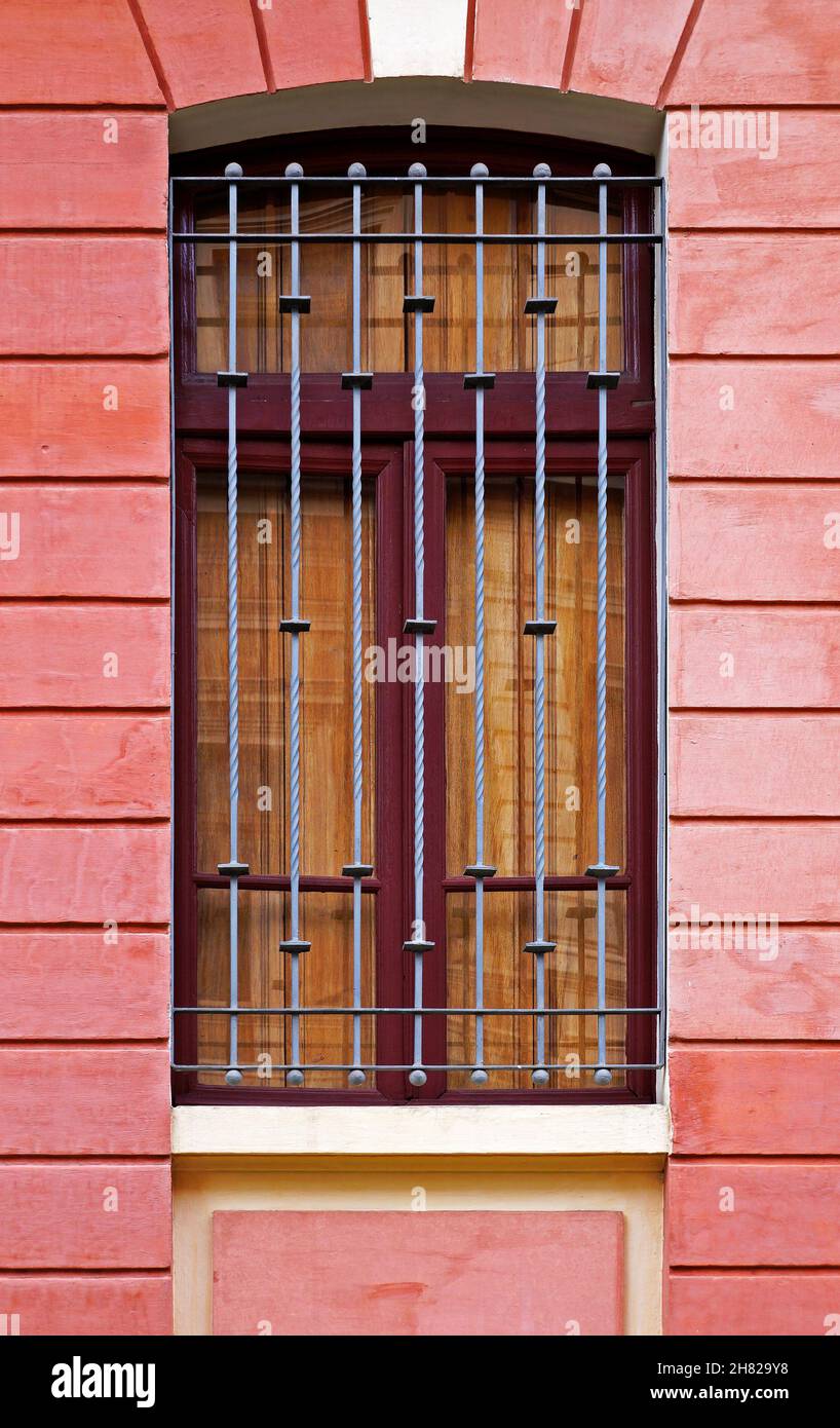 Window on ancient red facade in Belo Horizonte, Minas Gerais, Brazil ...