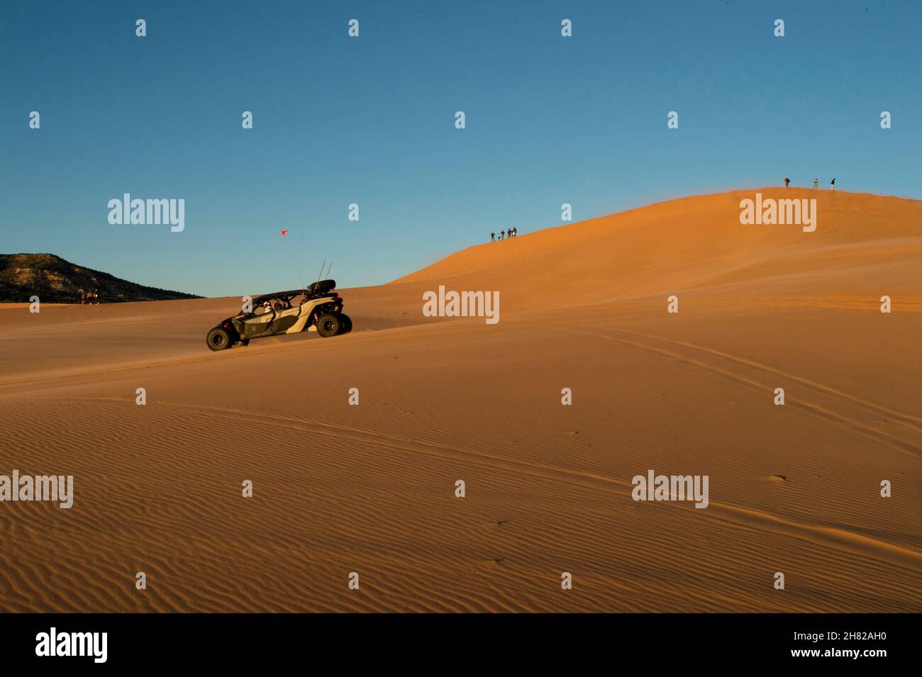 Dune buggy racing across the sand at Coral Pink Sand Dunes State Park Utah Stock Photo