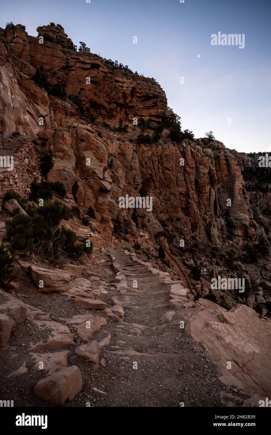 Tiny Moon Hangs Over The South Kaibab Trail In The Early Morning in the Grand Canyon Stock Photo