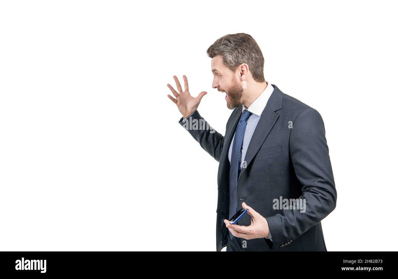 Angry executive manager in formal suit scream gesticulating half-turn, anger Stock Photo