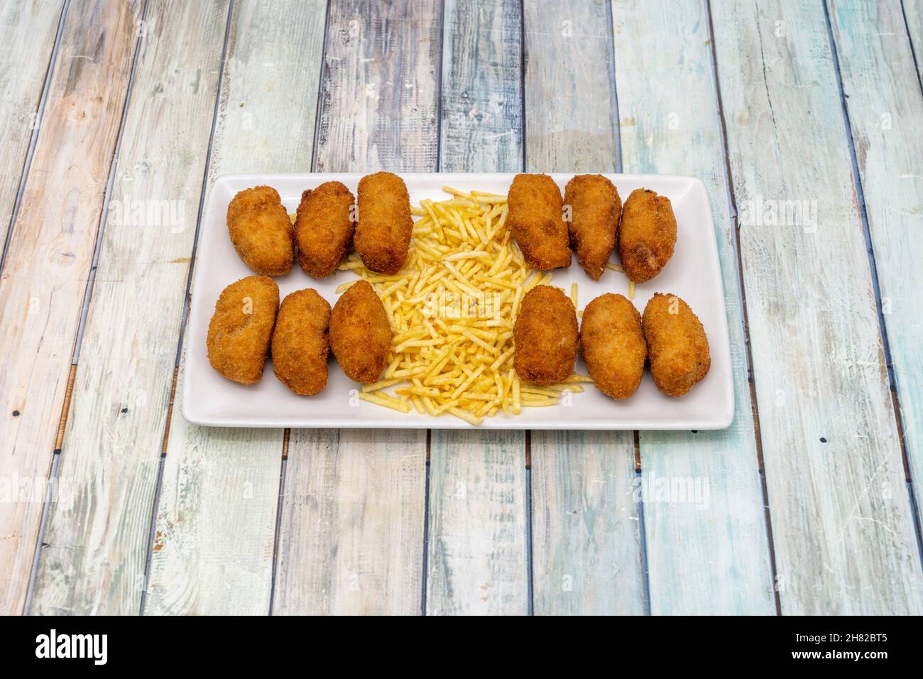 Delicious homemade Spanish croquettes stuffed with béchamel sauce with