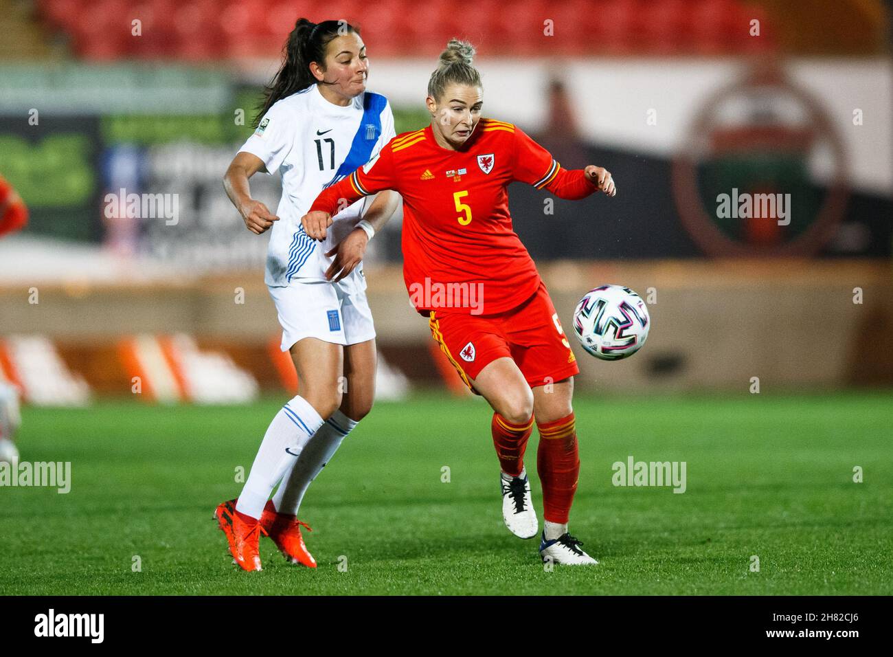 Llanelli, UK. 26 November, 2021. Rhiannon Roberts of Wales under pressure from Athanasia Moraitou of Greece during the Wales v Greece Women's World Cup Qualification match. Credit: Gruffydd Thomas/Alamy Stock Photo