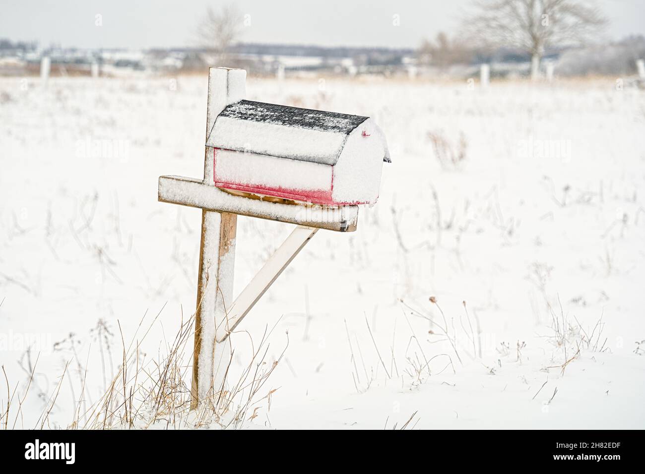 Mailbox out in a rural winter landscape. Stock Photo