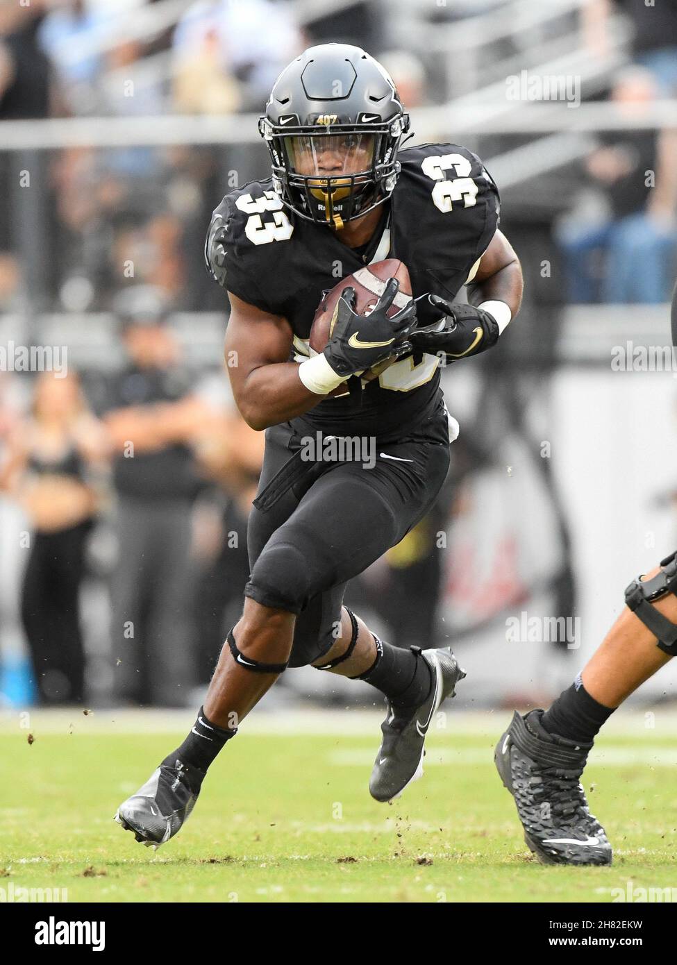 Orlando, FL, USA. 26th Nov, 2021. Central Florida running back Trillion Coles (33) during 1st half NCAA football game between the USF Bulls and the UCF Knights at the Bounce House in Orlando, Fl. Romeo T Guzman/Cal Sport Media/Alamy Live News Stock Photo