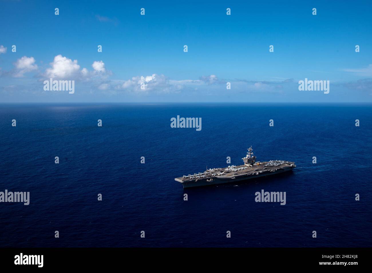 Philippine Sea. 11th Nov, 2021. The Nimitz-class aircraft carrier USS Carl Vinson (CVN 70) transits the Philippine Sea to Guam for a port visit, Nov. 11, 2021. The arrival of the Carl Vinson Carrier Strike Group marks the first time that a carrier strike group with the advanced capabilities of the F-35C Lightning II and Navy CMV-22B Osprey have visited Guam. The Carl Vinson Carrier Strike Group is on a scheduled deployment in the U.S. 7th Fleet area of operations to enhance interoperability through alliances and partnerships while serving as a ready-response force in support of a free and Stock Photo