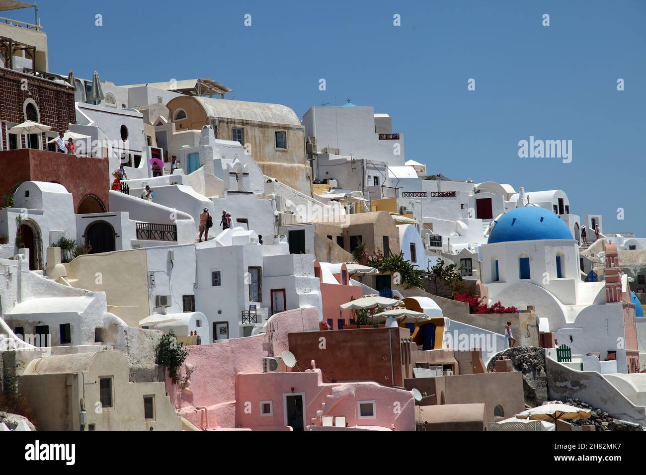 Oia Town at beautiful Greek island Santorini in Greece. Oia is a small town and former community in the South Aegean on the Santorini. Stock Photo