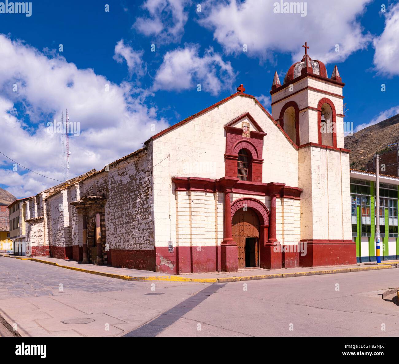Parish of San Juan Evangelista Ascension Huancavelica against a cloudy blue sky Stock Photo