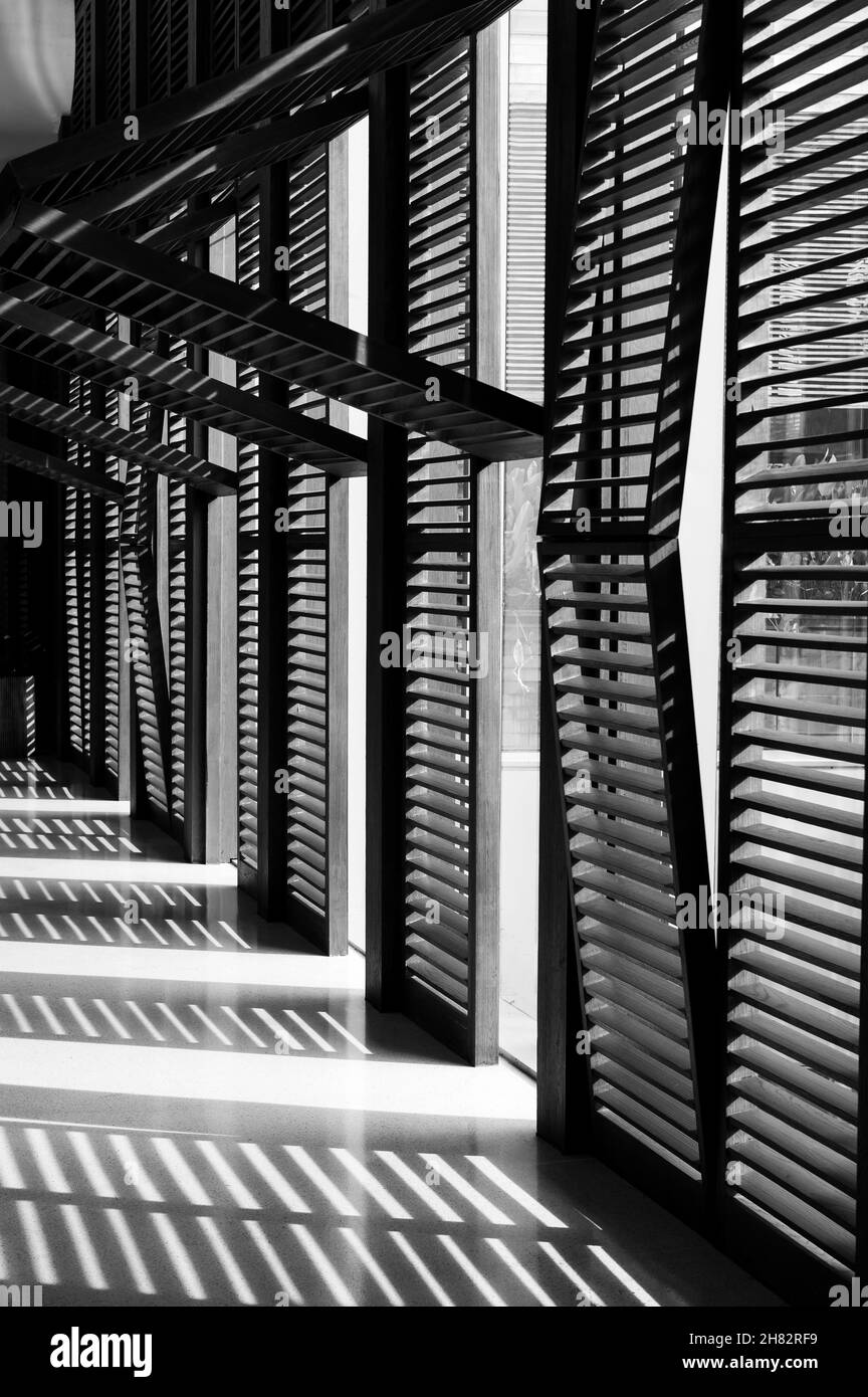 Window blinds with shadows on the floor Stock Photo