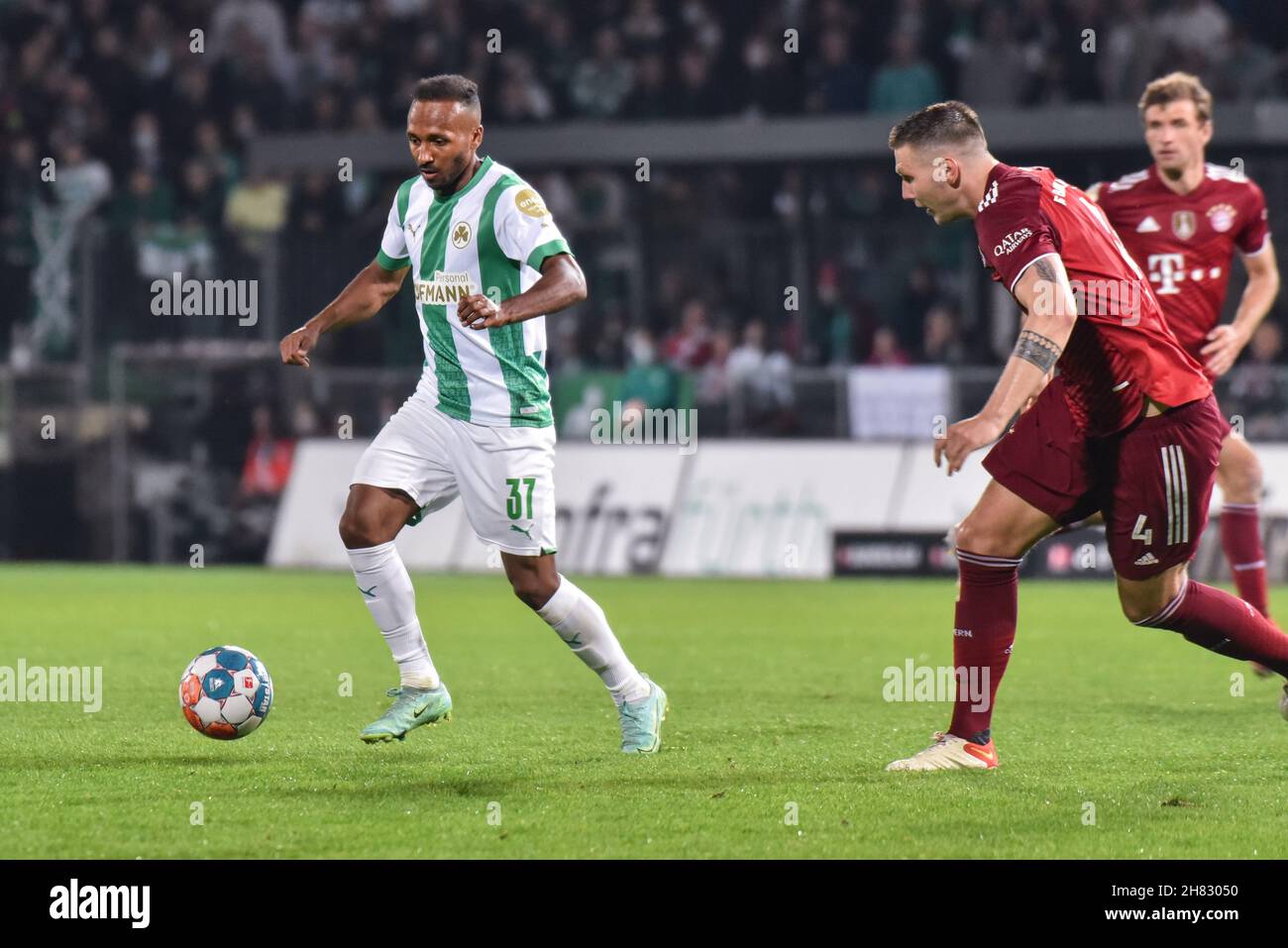 Deutschland, Fuerth, Sportpark Ronhof Thomas Sommer - 24.09.2021 - Fussball, 1.Bundesliga - SpVgg Greuther Fuerth vs. FC Bayern Munich  Image: (fLTR) Julian Green (SpVgg Greuther Fürth,37), Niklas Suele (FC Bayern Munich,4)  DFL regulations prohibit any use of photographs as image sequences and or quasi-video Stock Photo