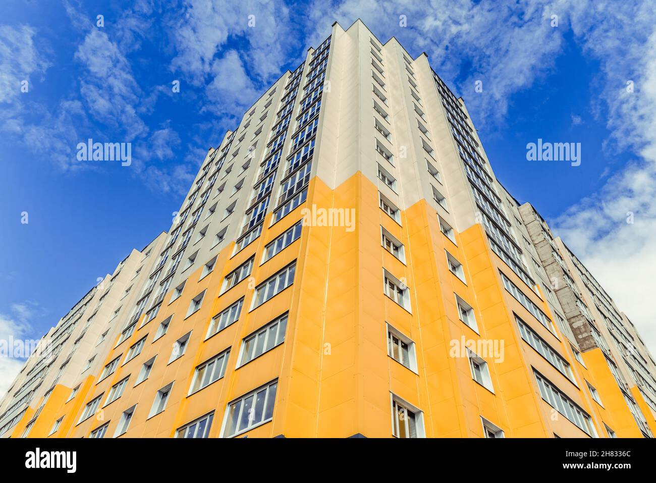 Bottom view of skyscraper with a blue sky backgroung Stock Photo - Alamy