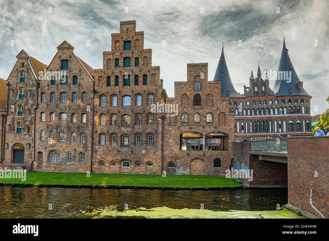 Salt warehouses in Lübeck, behind the medieval gate of the Holstentor. Luebeck, Schleswig-Holstein, Germany, Europe Stock Photo