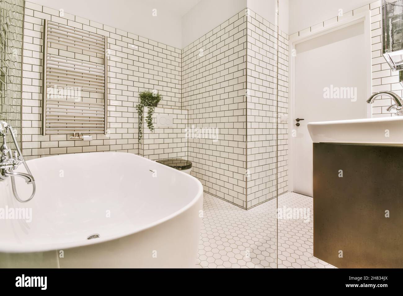 Stylish bathroom with unusual brick tiles and unusual flooring Stock