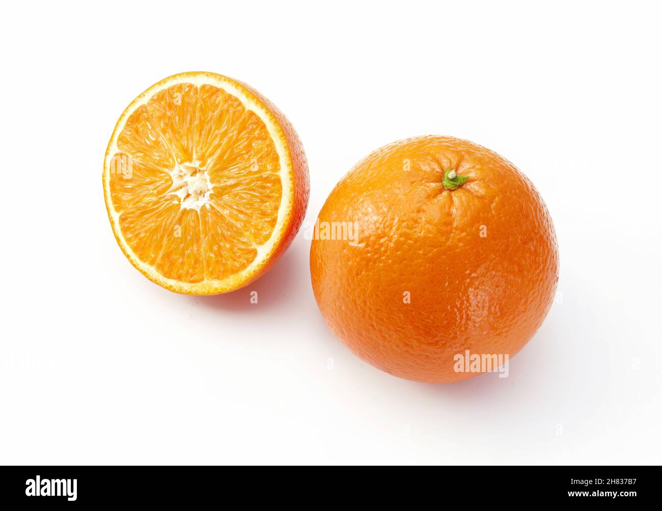 Oranges on white background. One whole and a half. Stock Photo