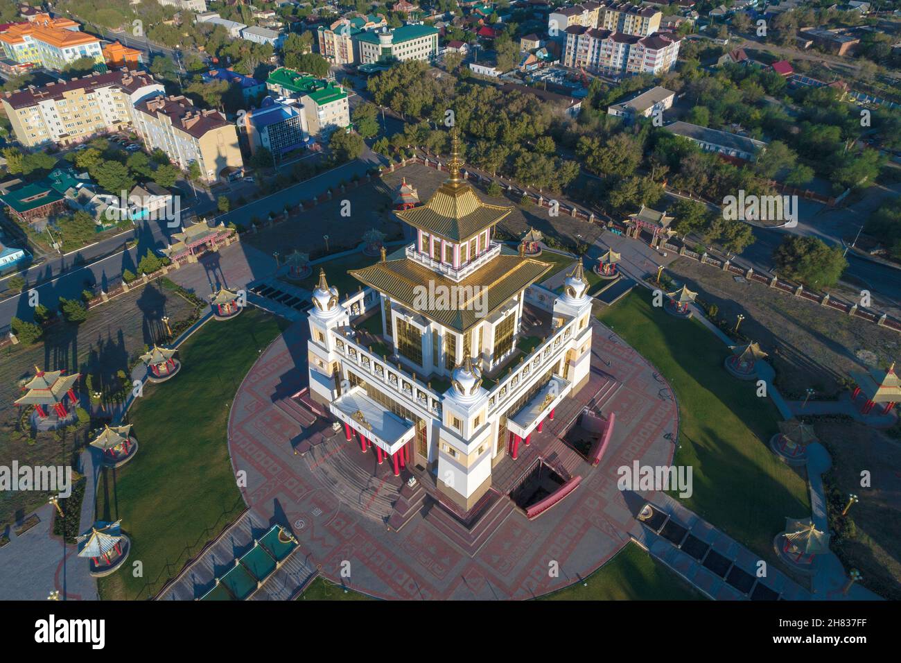 Above the Buddhist temple 'Golden Abode of Buddha Shakyamuni' on a sunny morning (aerial photography). Elista, Russia Stock Photo