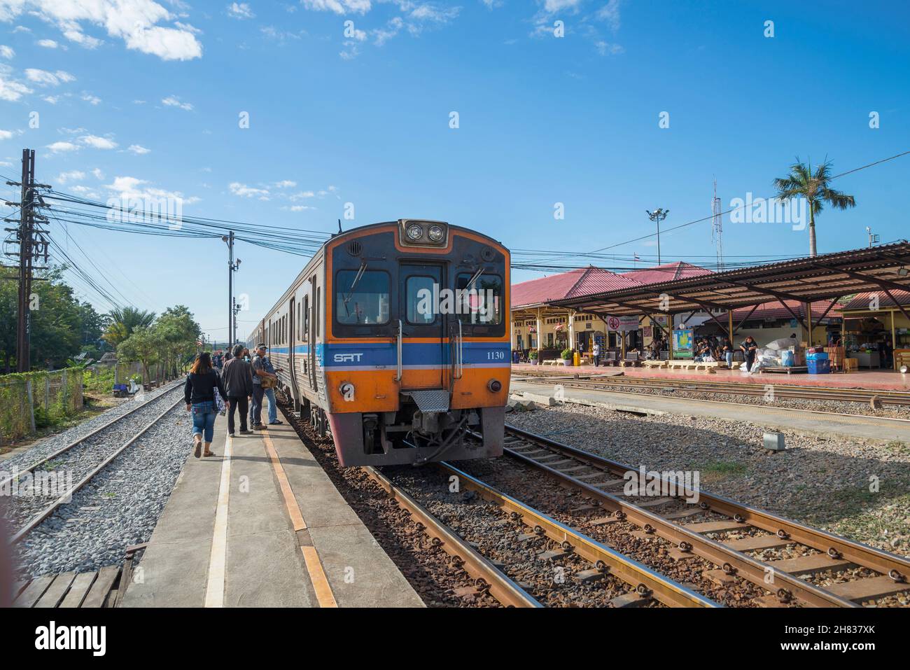 AYUTTHAYA, THAILAND - JAN 02, 2017: Passenger train at the platform of Ayutthaya railway station on a sunny day Stock Photo