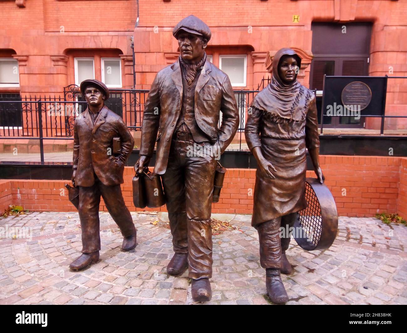 Wigan mining history. statue features a miner, pit brow lass and a child sculptor Steve Winterburn Wigan, UK. Industrial revolution concept Stock Photo